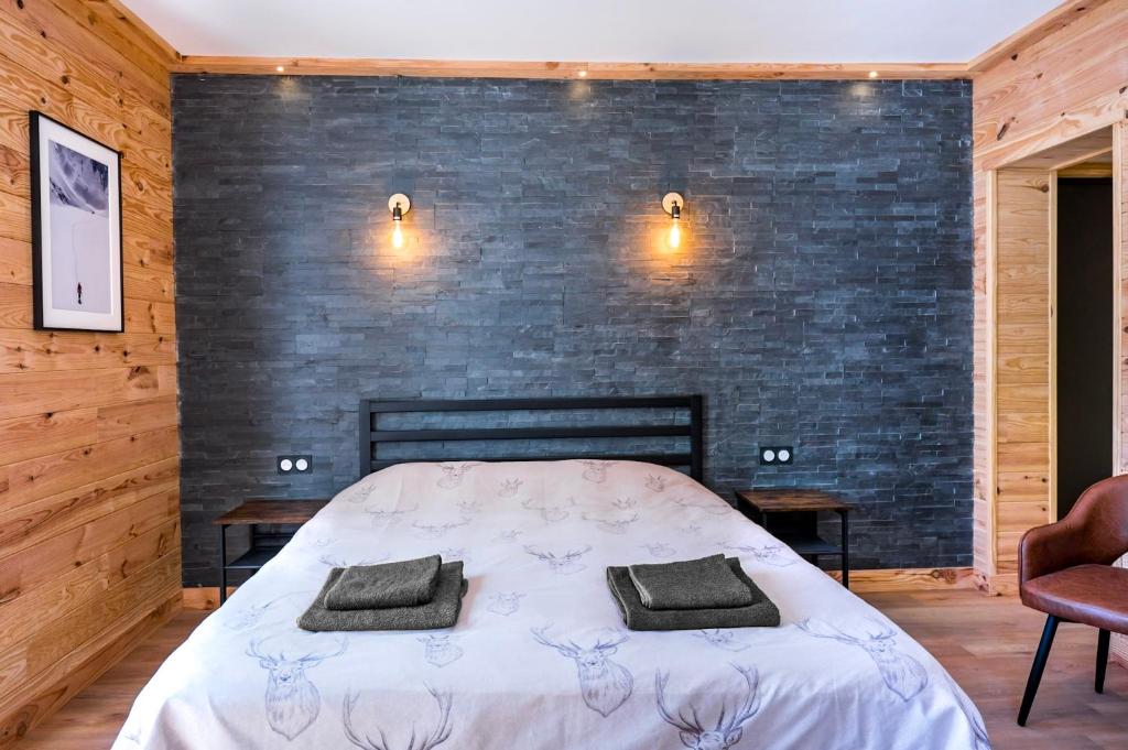 Letto o letti in una camera di Apart Hôtel des Cols