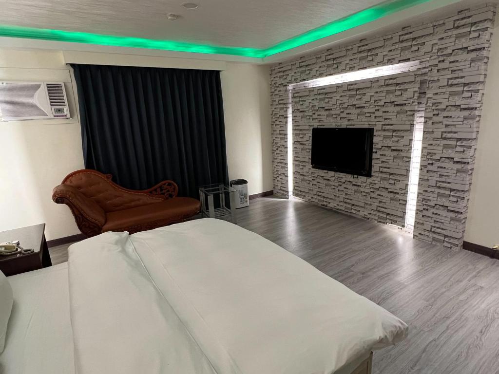 Postel nebo postele na pokoji v ubytování Hua Du Motel