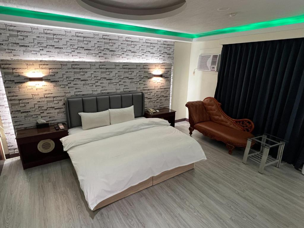 Postel nebo postele na pokoji v ubytování Hua Du Motel