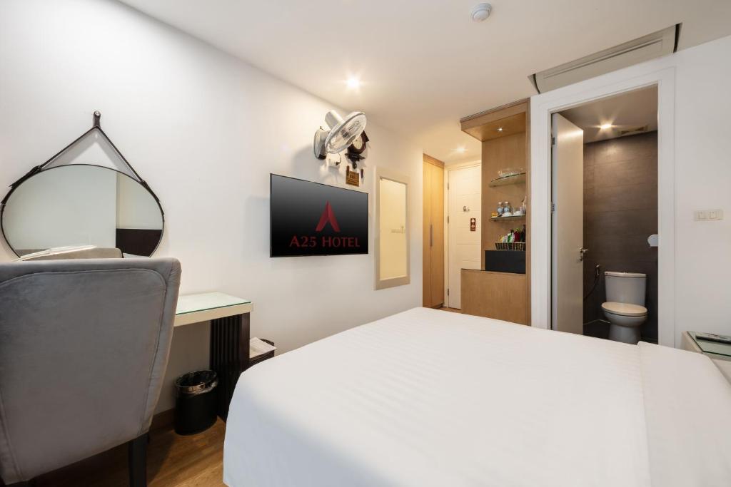 Postel nebo postele na pokoji v ubytování A25 Hotel - 66 Trần Thái Tông