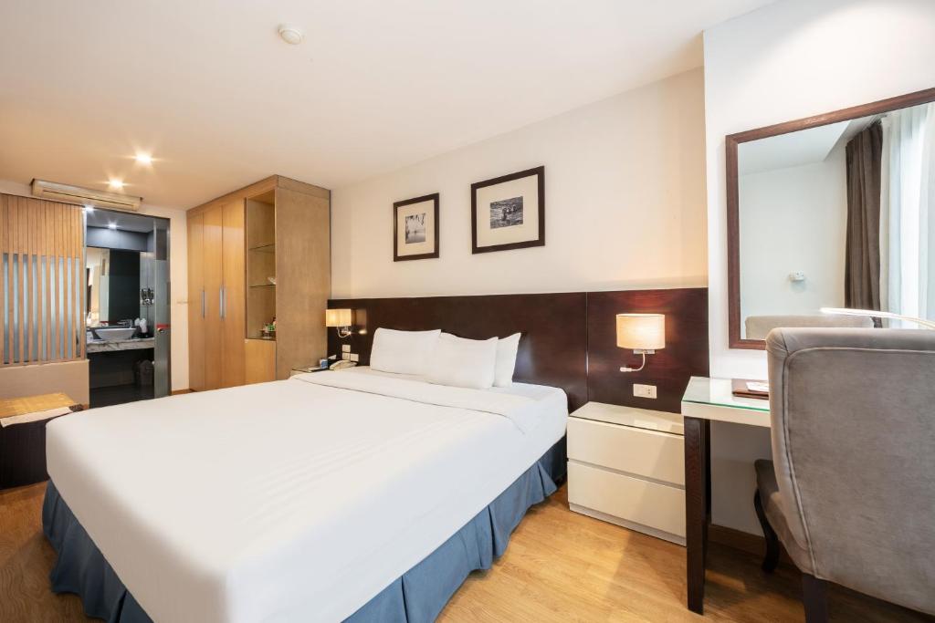 Postel nebo postele na pokoji v ubytování A25 Hotel - 66 Trần Thái Tông