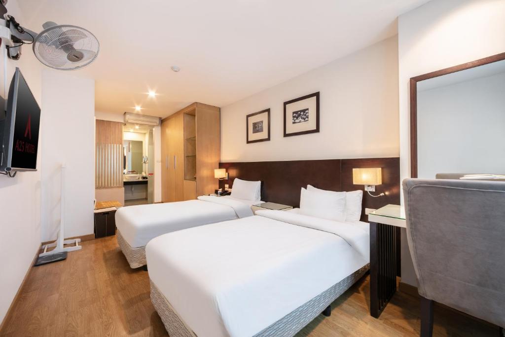 Postel nebo postele na pokoji v ubytování A25 Hotel - 66 Trần Thái Tông