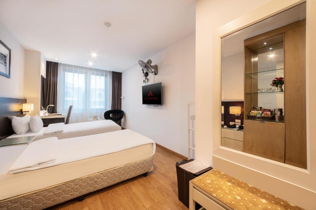 Postel nebo postele na pokoji v ubytování A25 Hotel - 66 Trần Thái Tông