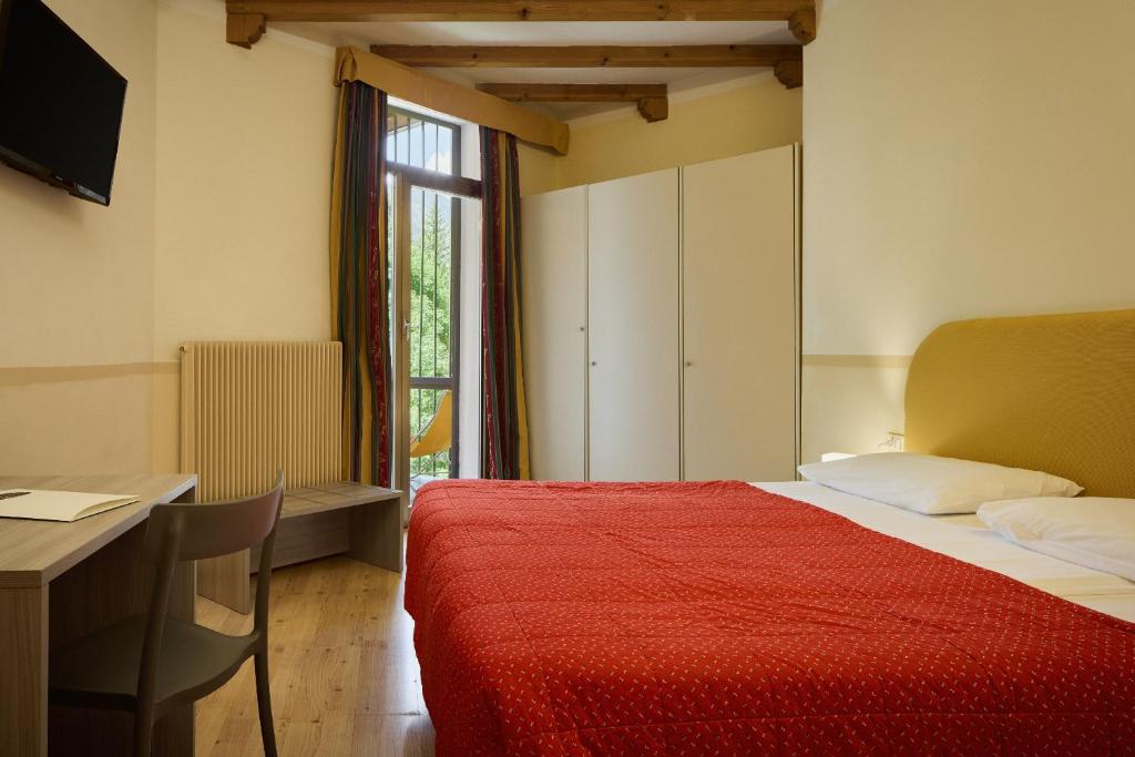 Postel nebo postele na pokoji v ubytování Hotel Portavescovo