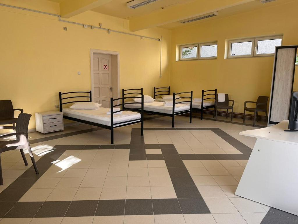 Postel nebo postele na pokoji v ubytování Tulipan Hotel Aquapark