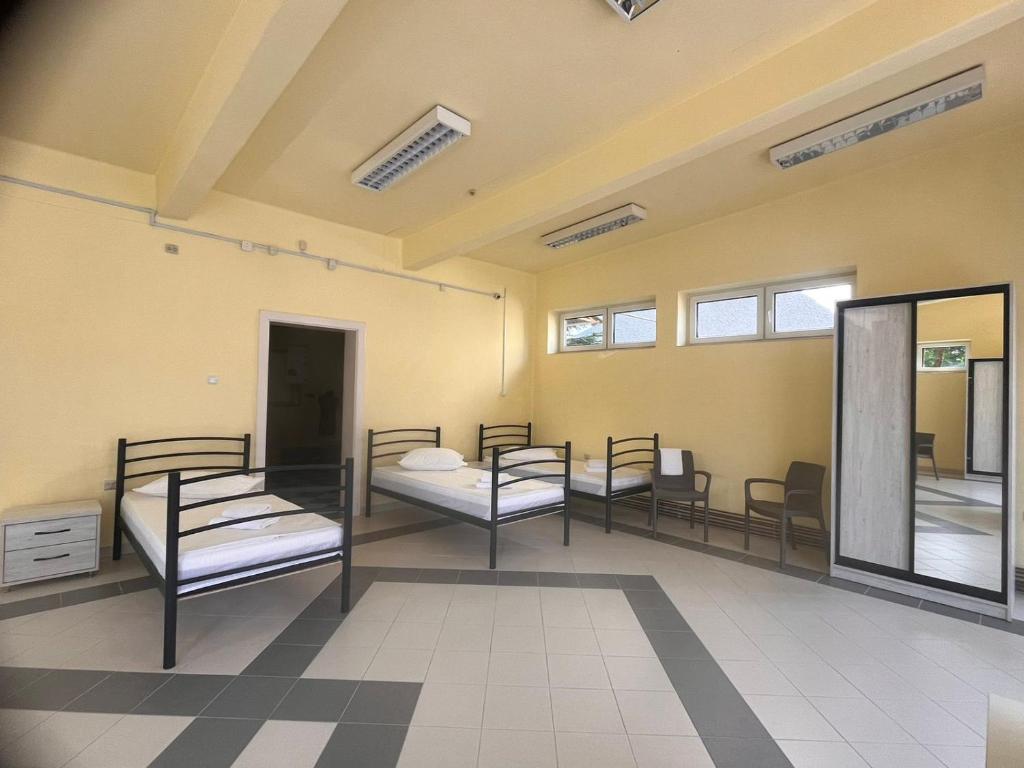 Postel nebo postele na pokoji v ubytování Tulipan Hotel Aquapark