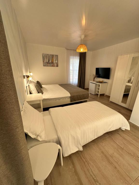 Postel nebo postele na pokoji v ubytování Halta Pescăruş Accommodation