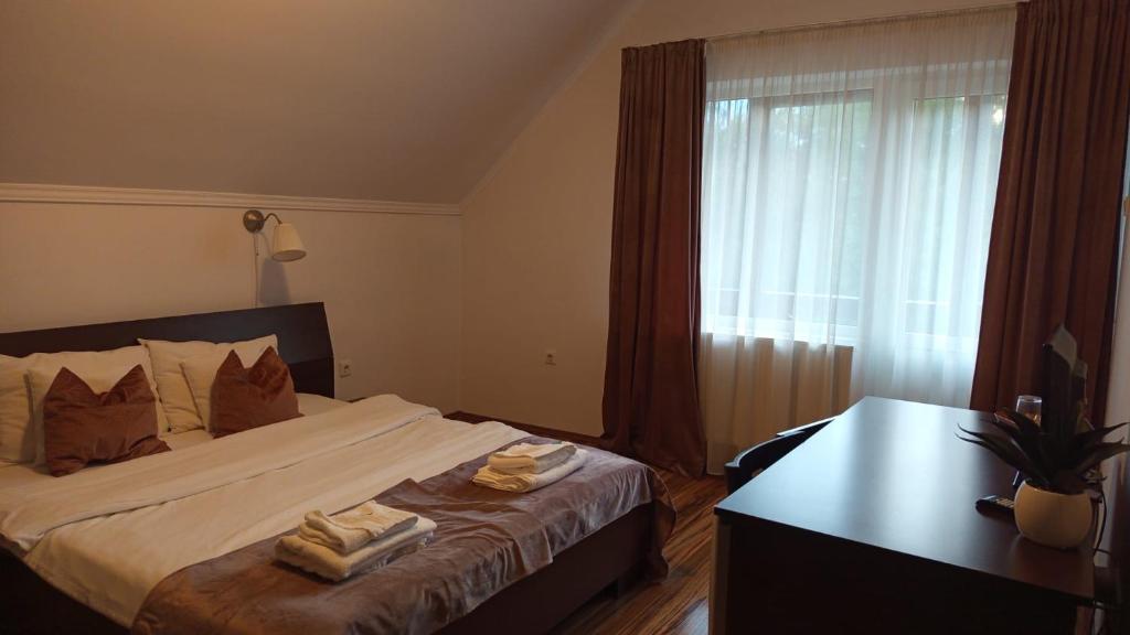 Postel nebo postele na pokoji v ubytování Vila Man
