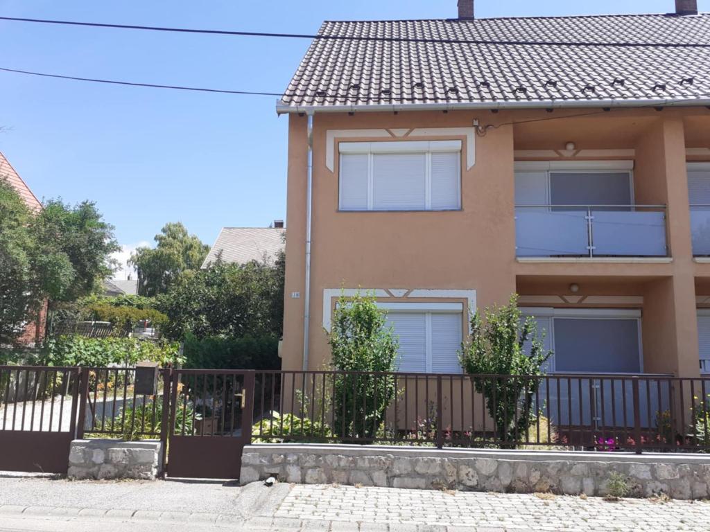 a house with a fence in front of it at Ibolya in Balatonfüred