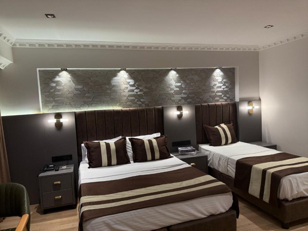 A bed or beds in a room at Blue Istanbul Hotel Taksim