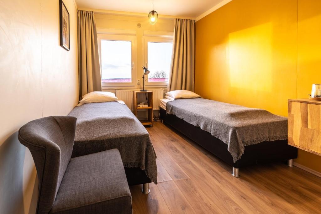 Postel nebo postele na pokoji v ubytování Adventure Hotel Hof