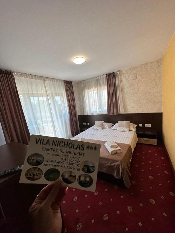 Postel nebo postele na pokoji v ubytování Vila NICHOLAS