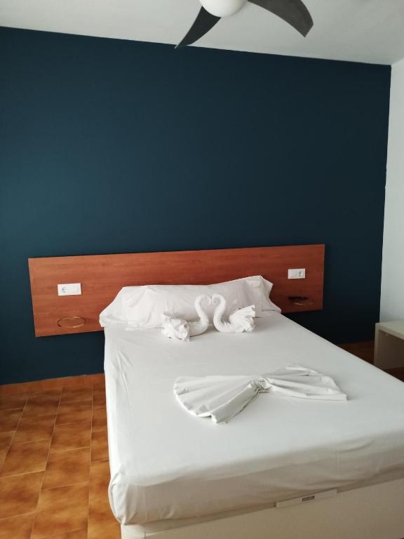 Postel nebo postele na pokoji v ubytování Nou Rocamar