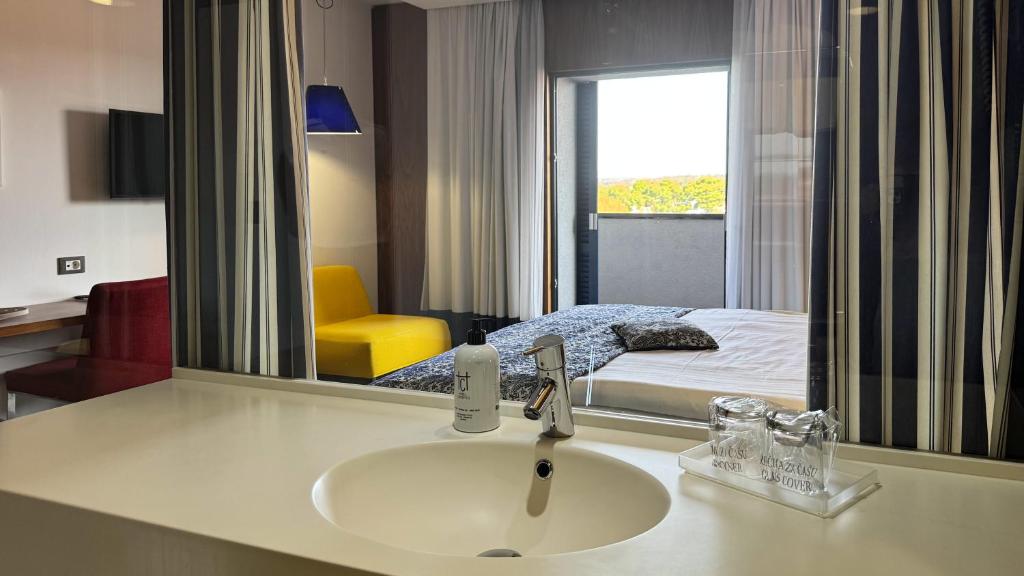 Postel nebo postele na pokoji v ubytování Hotel IN