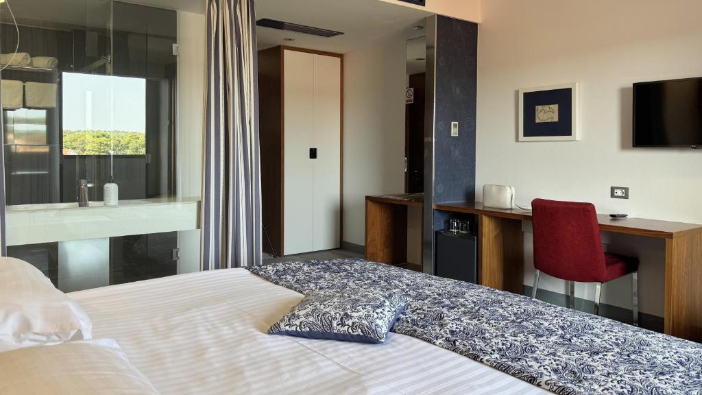 Postel nebo postele na pokoji v ubytování Hotel IN