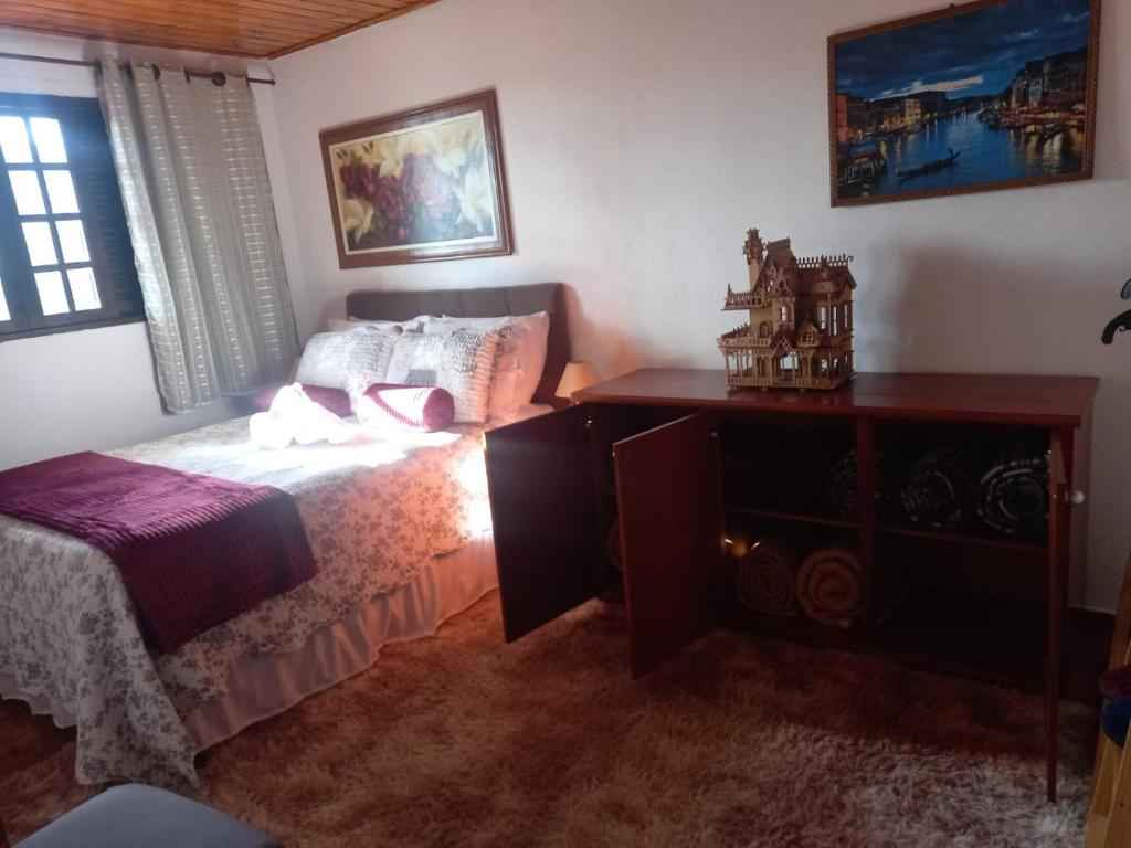 Postel nebo postele na pokoji v ubytování Casa de Boneca