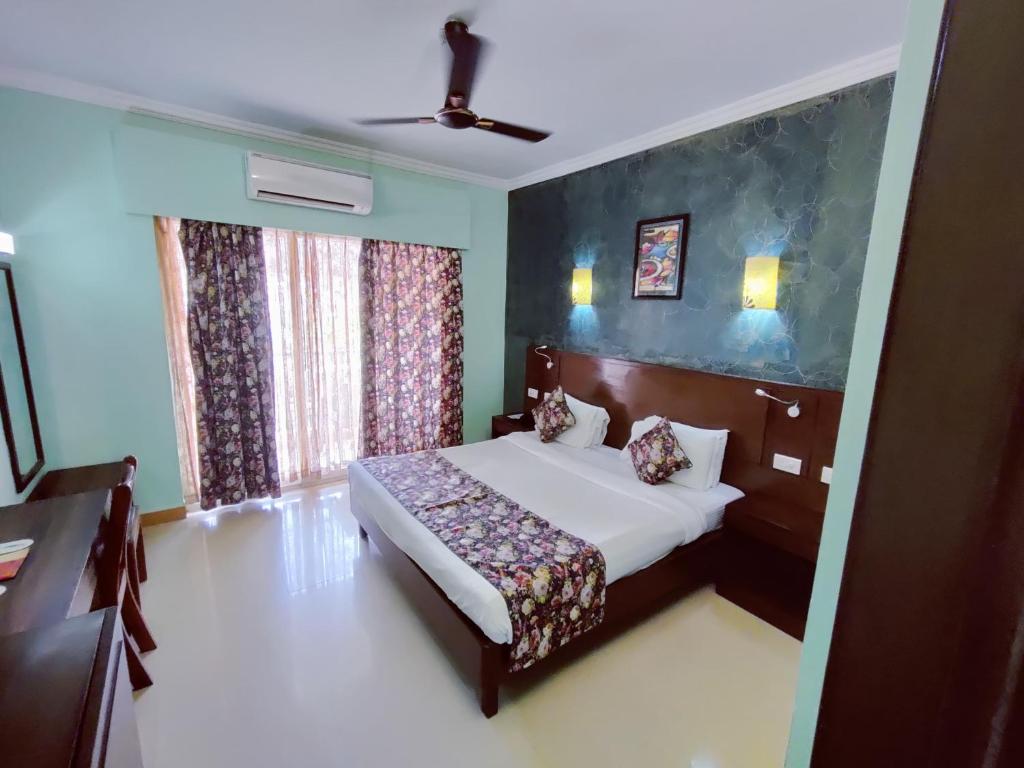 Postel nebo postele na pokoji v ubytování Hotel Goan Heritage