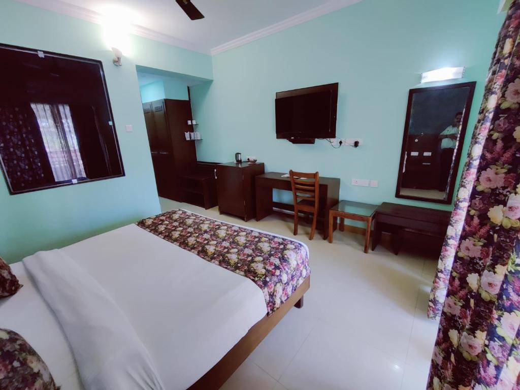 Postel nebo postele na pokoji v ubytování Hotel Goan Heritage