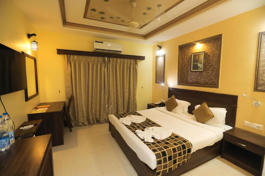 Postel nebo postele na pokoji v ubytování Hotel Goan Heritage