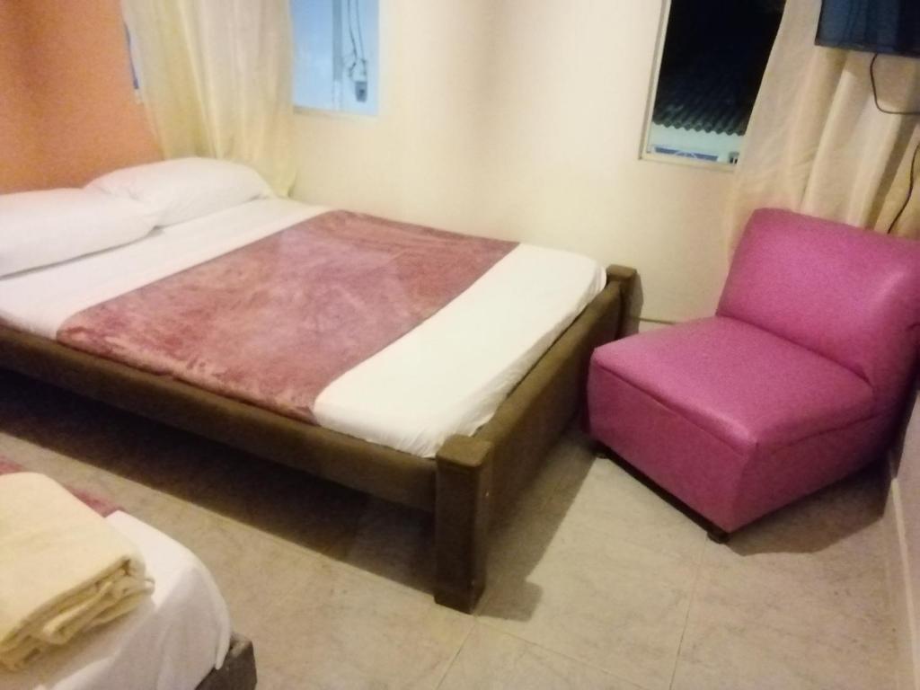 Postel nebo postele na pokoji v ubytování Sai hostels