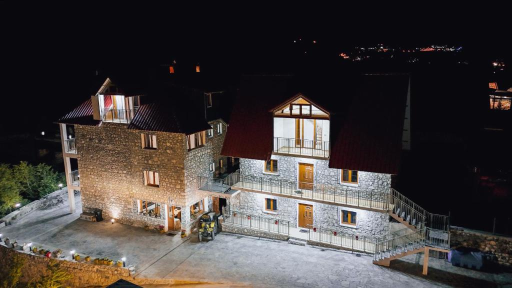 an aerial view of a building at night at Hotel Zallina in Theth