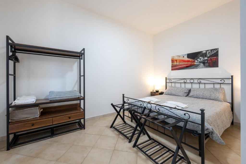 Ένα ή περισσότερα κρεβάτια σε δωμάτιο στο Dimora Alessandrina