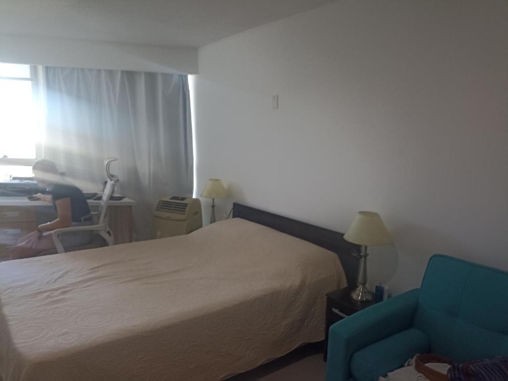 Giường trong phòng chung tại Apartamento