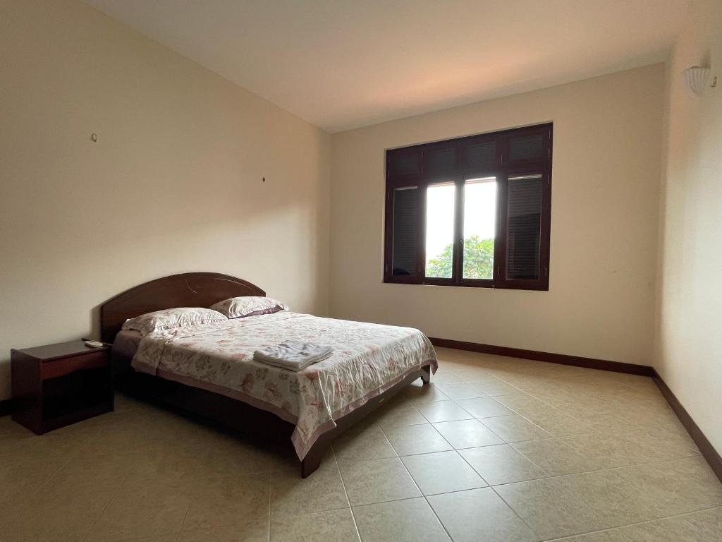 Postel nebo postele na pokoji v ubytování Biệt Thự C19 Mũi Né Domaine