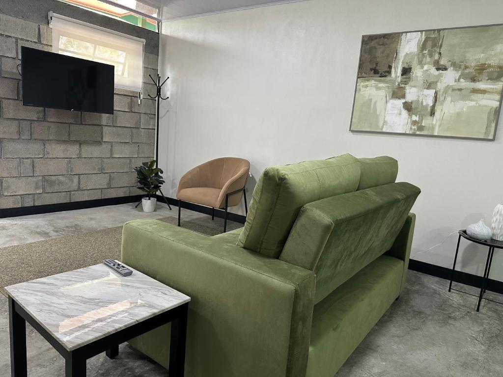 TV a/nebo společenská místnost v ubytování Casa del Cafe-Familiar