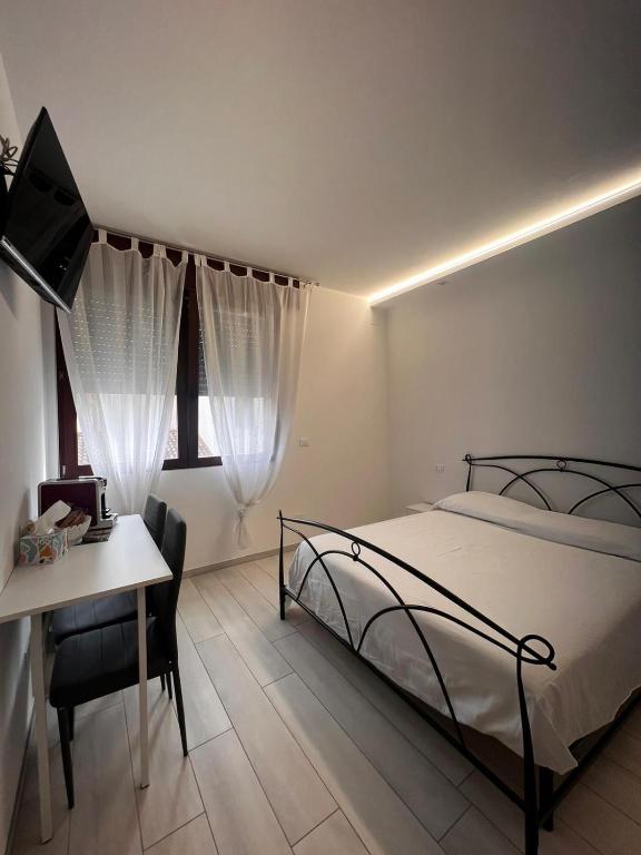 Postel nebo postele na pokoji v ubytování RoomsCarli