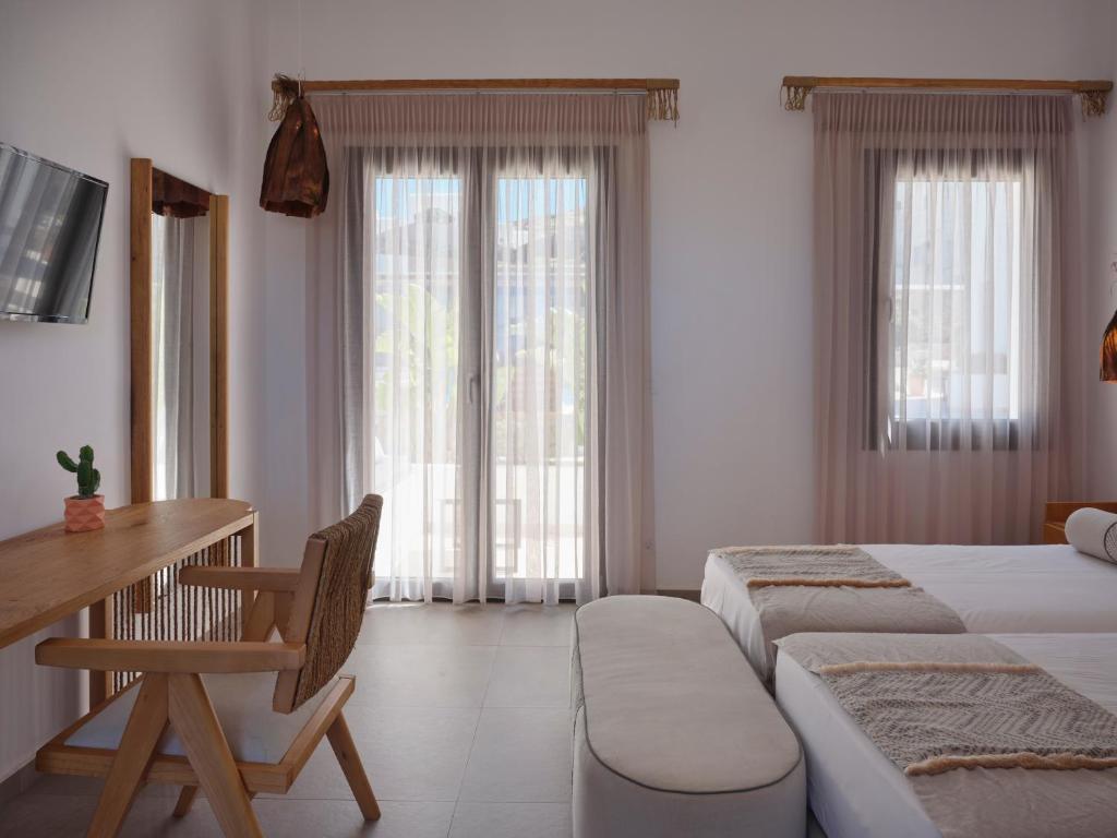 Postel nebo postele na pokoji v ubytování Le Palme Mykonos