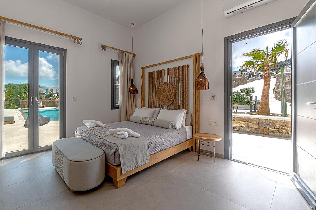 Postel nebo postele na pokoji v ubytování Le Palme Mykonos