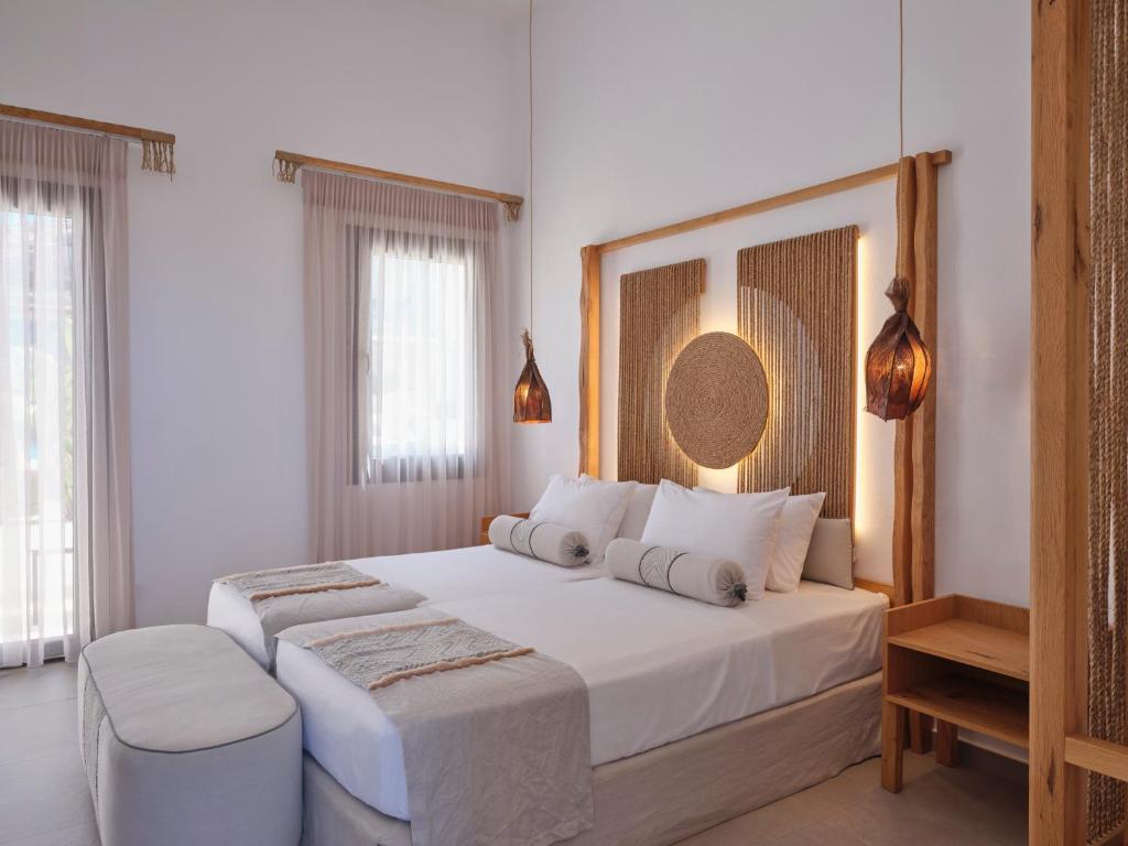 Postel nebo postele na pokoji v ubytování Le Palme Mykonos