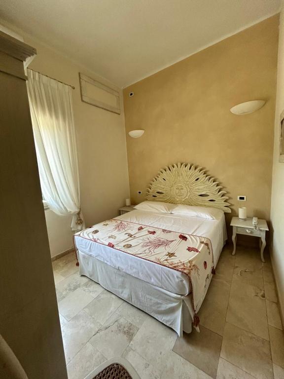 Postel nebo postele na pokoji v ubytování Hotel Bagni Lido