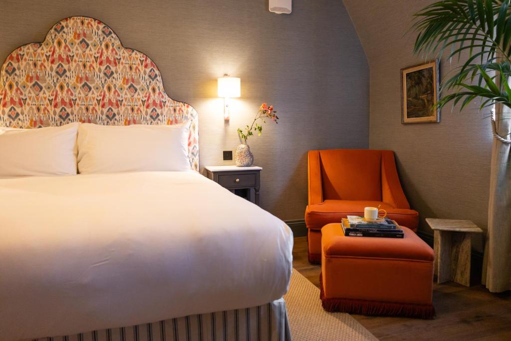 Postel nebo postele na pokoji v ubytování The Hatmaker Boutique Hotel