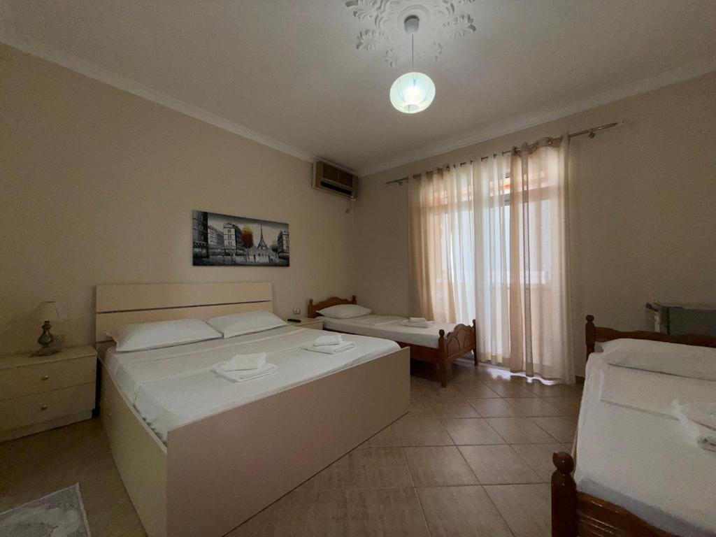 Postel nebo postele na pokoji v ubytování GuestHouse NOVI