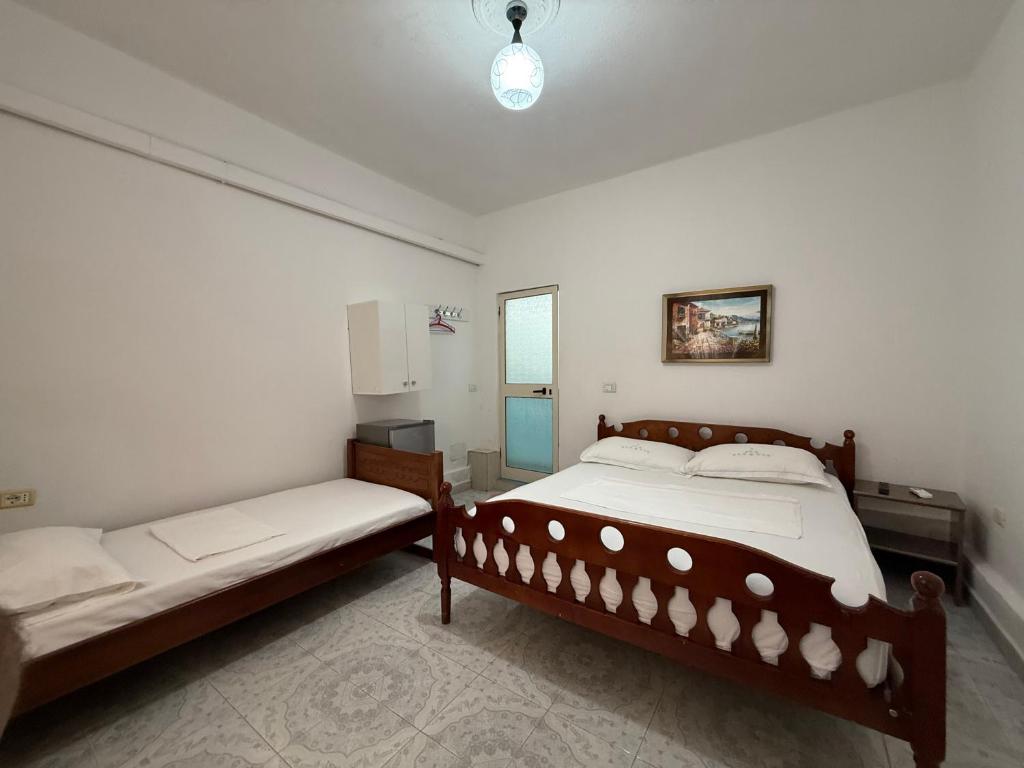 Postel nebo postele na pokoji v ubytování GuestHouse NOVI
