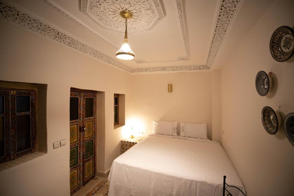 Postel nebo postele na pokoji v ubytování Riad Fez Unique