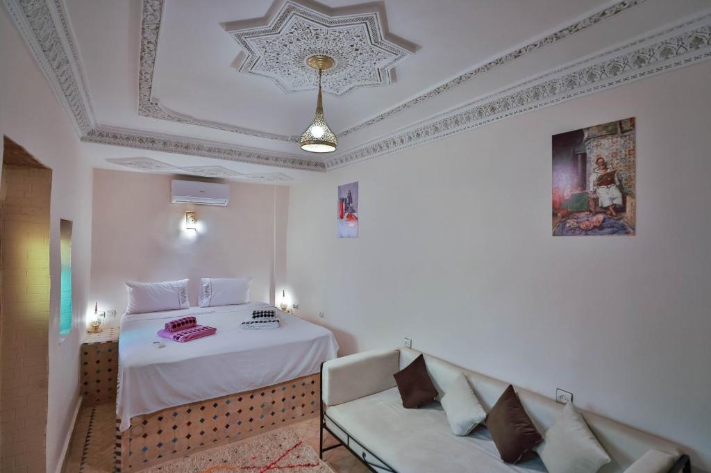 Postel nebo postele na pokoji v ubytování Riad Fez Unique