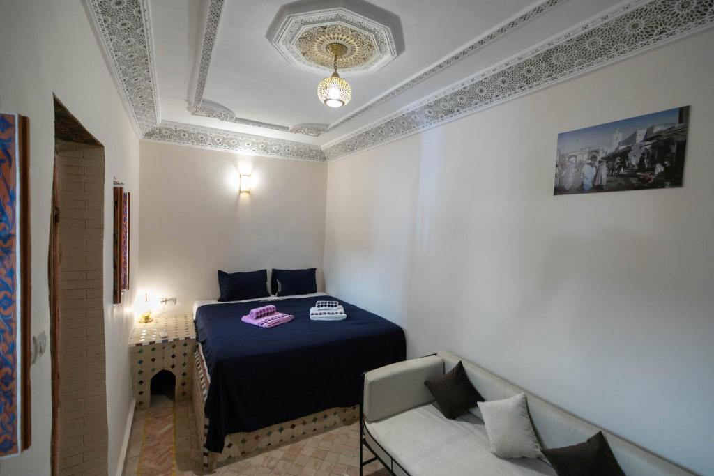 Postel nebo postele na pokoji v ubytování Riad Fez Unique
