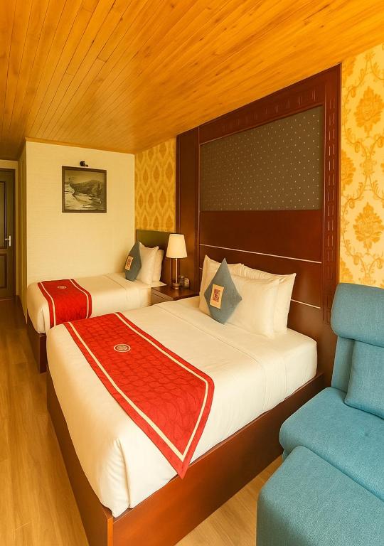 Postel nebo postele na pokoji v ubytování Sapa Elegance Hotel