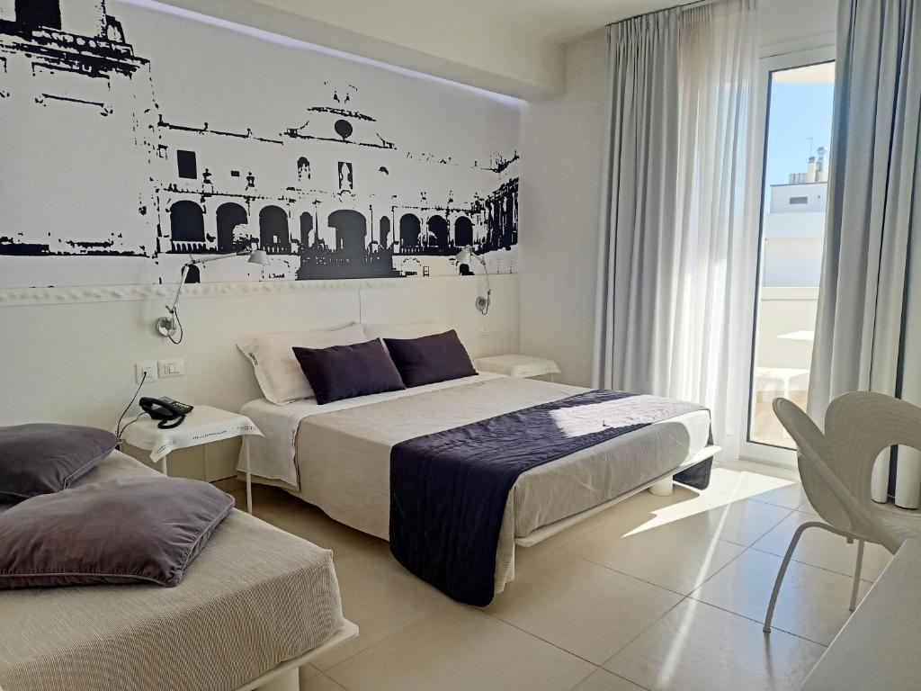 Postel nebo postele na pokoji v ubytování QuiHotel