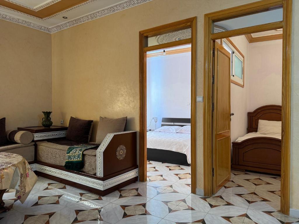 Postel nebo postele na pokoji v ubytování Appartements dior al hoceima