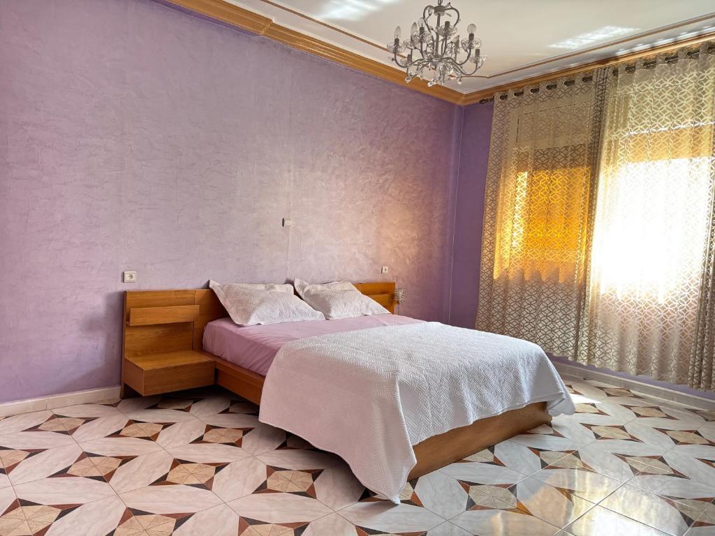 Postel nebo postele na pokoji v ubytování Appartements dior al hoceima