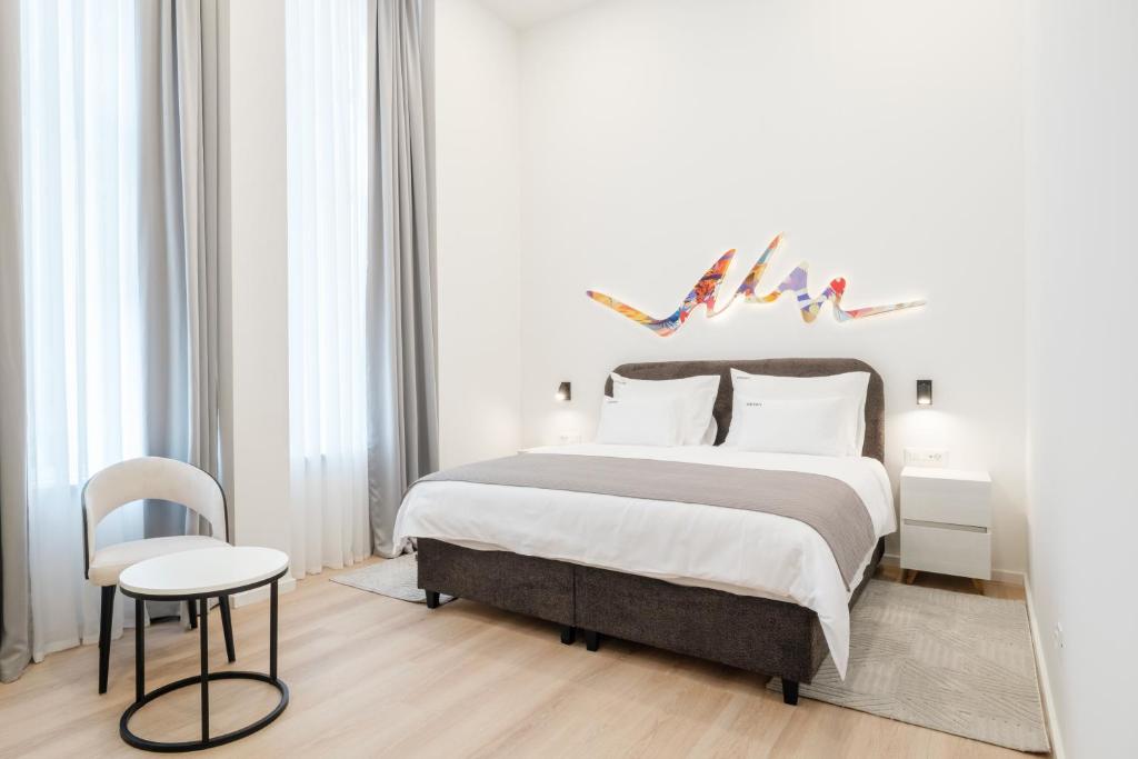 Postel nebo postele na pokoji v ubytování Hotel Eleven