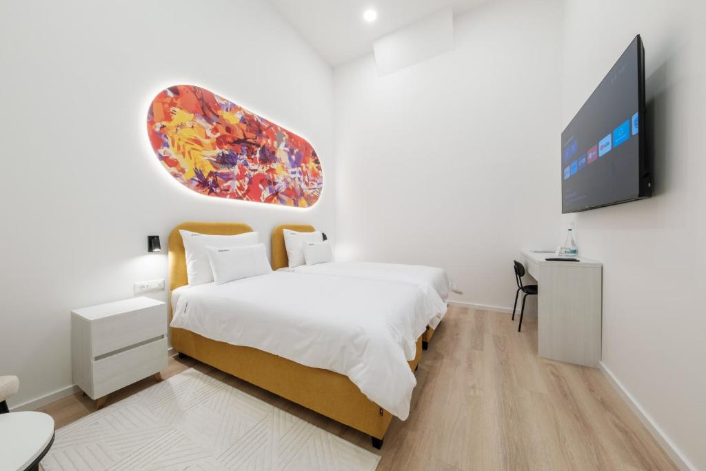 TV a/nebo společenská místnost v ubytování Hotel Eleven