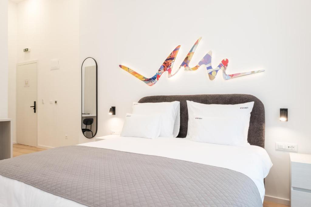Postel nebo postele na pokoji v ubytování Hotel Eleven