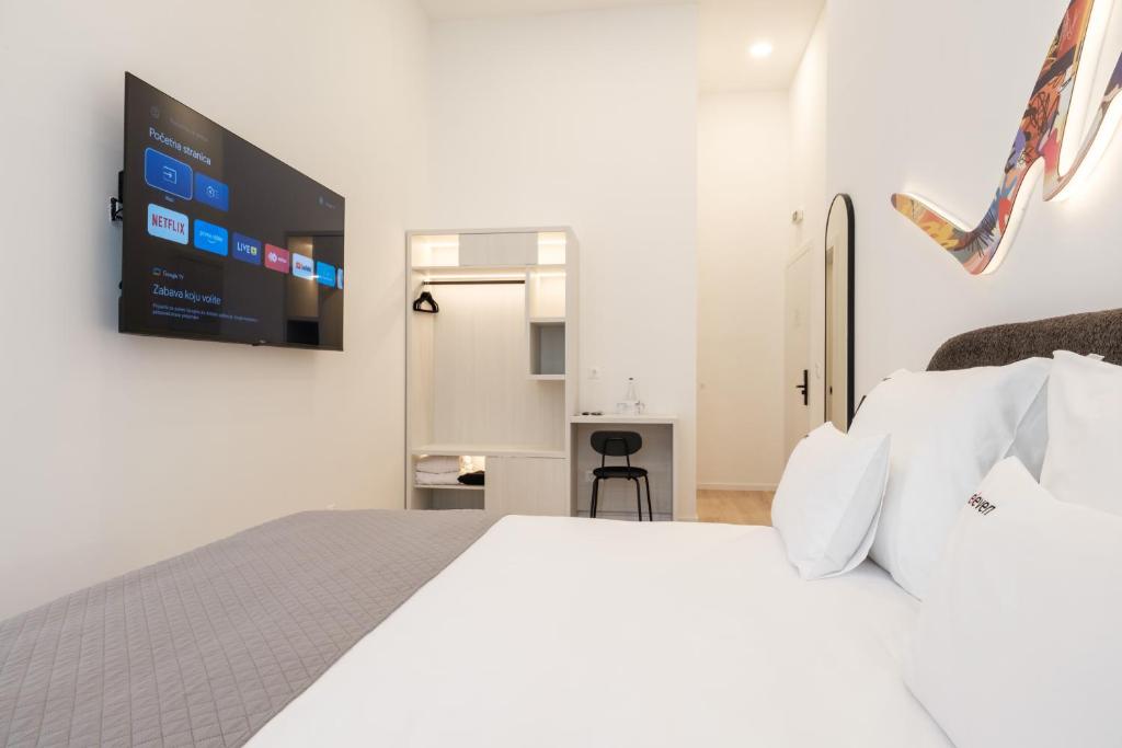 Postel nebo postele na pokoji v ubytování Hotel Eleven