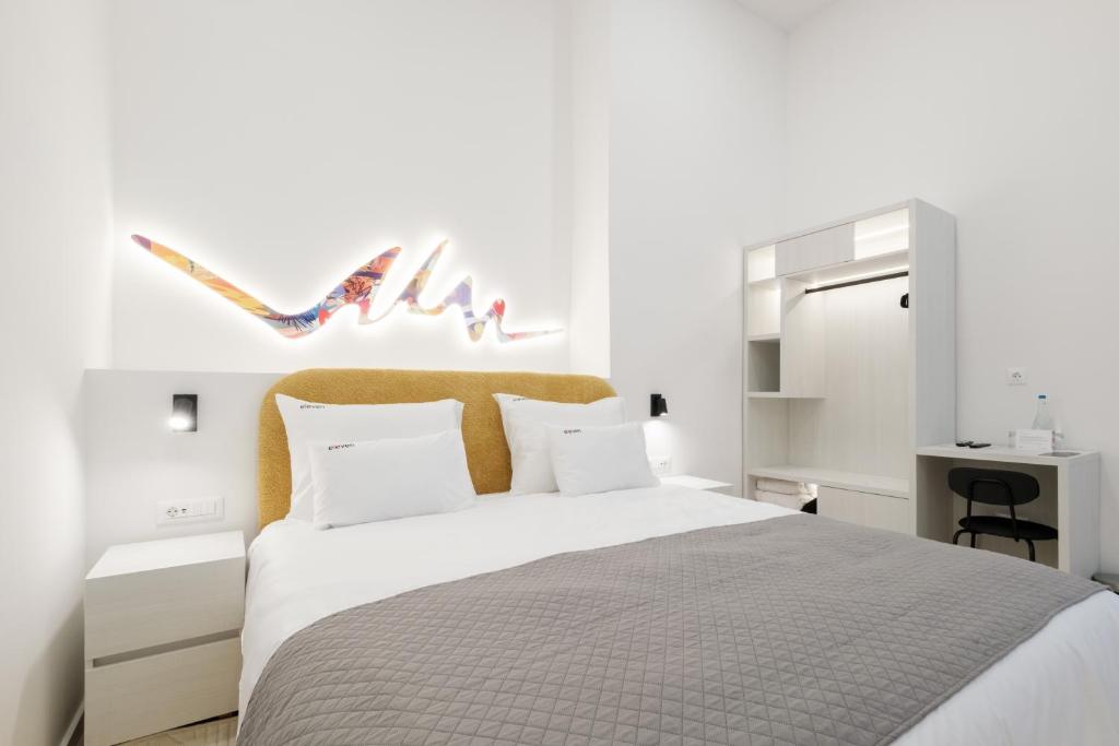 Postel nebo postele na pokoji v ubytování Hotel Eleven