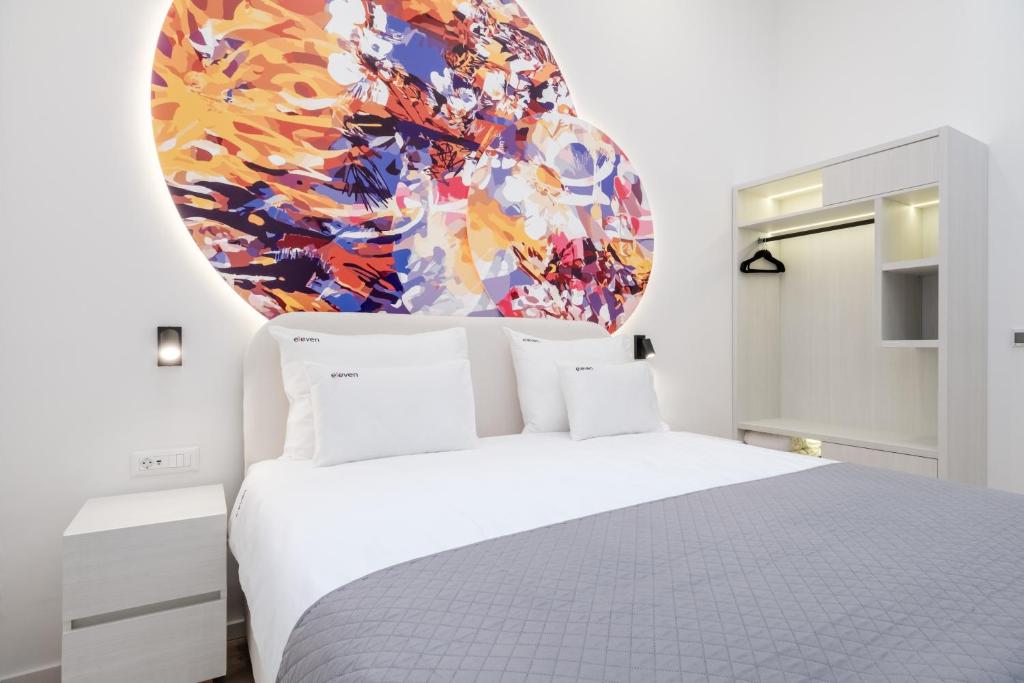 Postel nebo postele na pokoji v ubytování Hotel Eleven